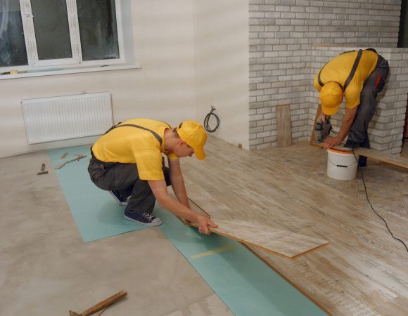 male-worker-installing-new-wooden-laminate-floorin-2024-09-14-02-22-07-utc-scaled.jpg